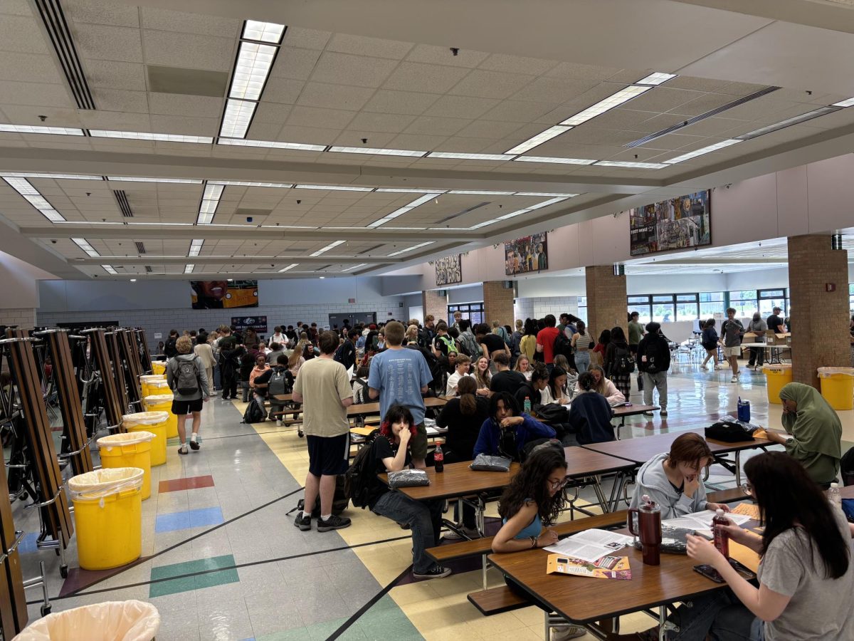 The class of 2025 gathering in the school cafeteria as a moment for seniors to talk about their high school years, pick up their graduation caps, and to meet up with old classmates to revisit their old elementary schools.
A Birds Eye view of the class of 2025 gathering in the school cafeteria as a moment for seniors to talk about their high school years, pick up their graduation caps, and to meet up with old classmates to revisit their old elementary schools.